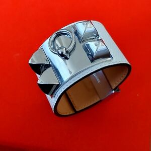 White leather bracelet with metal details